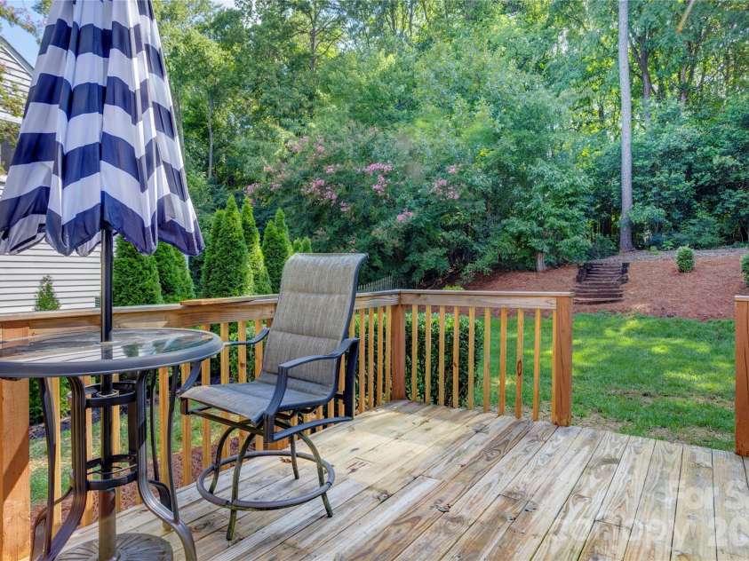 156 Edgewater Drive, Concord, NC 28027.  MLS# CAR4413561, YatesRealty ID 44298. Relax on the shady deck overlooking the large back yard