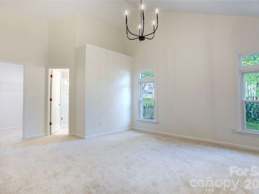 156 Edgewater Drive, Concord, NC 28027.  MLS# CAR4413561, YatesRealty ID 44298. Updated primary with new lighting and plush carpet
