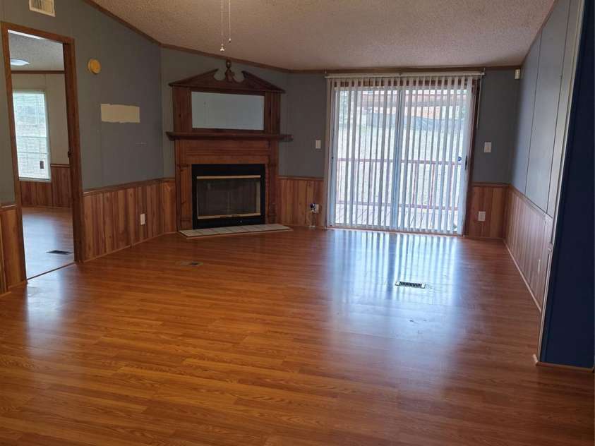 1044 Rabbit Trail, Gastonia, NC 28052.  MLS# CAR4334931, YatesRealty ID 4430. Living room with gas log fireplace