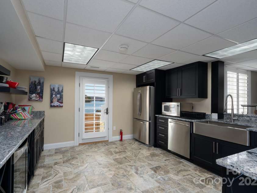 444 Glenbrook Springs None, New London, NC 28127.  MLS# CAR4328199, YatesRealty ID 4430. Lower Level Kitchen