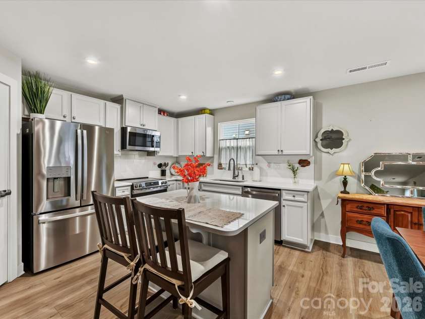 557 Nesbe Street, Lancaster, SC 29720.  MLS# CAR4411330, YatesRealty ID 44303. Kitchen with Upgraded Cabinets, Subway Tiled Backsplash, Quartz Counters
