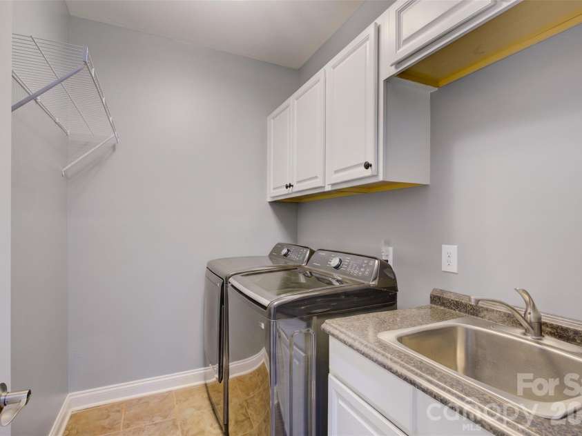 16815 Crosshaven Drive, Charlotte, NC 28278.  MLS# CAR4407553, YatesRealty ID 44305. Virtually painted laundry room