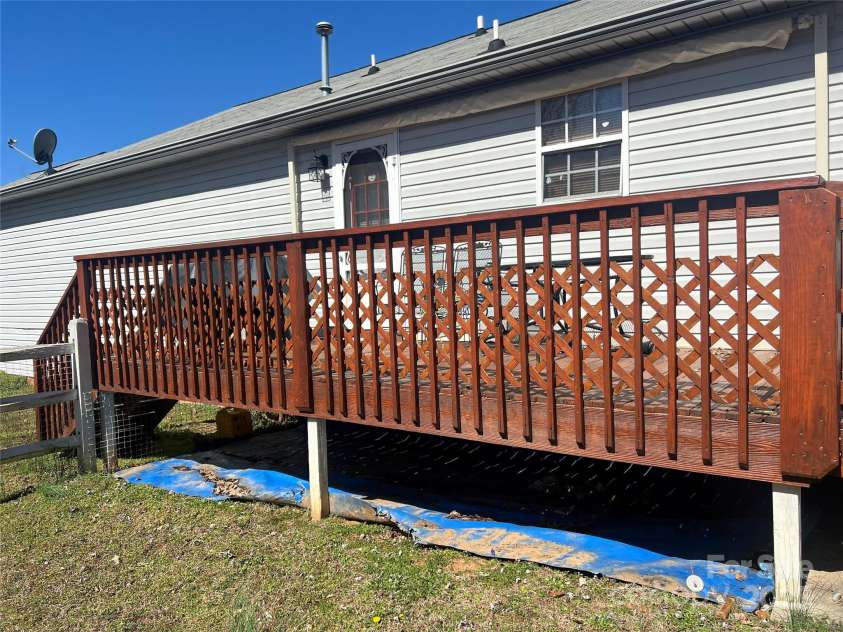 376 Brook Green Place, Concord, NC 28027.  MLS# CAR4230406, YatesRealty ID 4432. Side ramp leading to a deck.