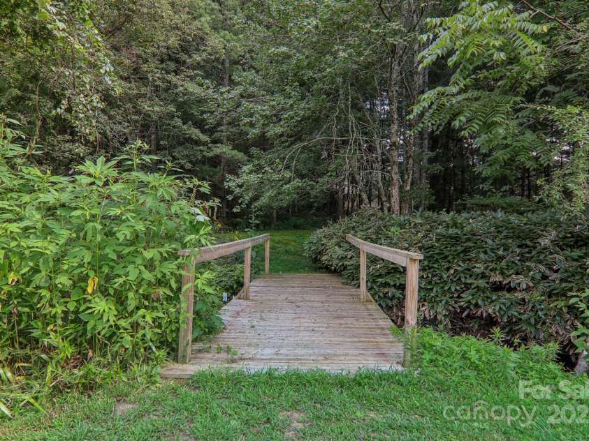 23 Country Meadows Lane, Hendersonville, NC 28792.  MLS# CAR4172601, YatesRealty ID 4433. BBridge to trail