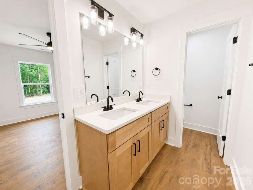 2697 Kendelwood Drive, Lancaster, SC 29720.  MLS# CAR4409067, YatesRealty ID 44346. Dual vanity with quartz counters in Primary bathroom