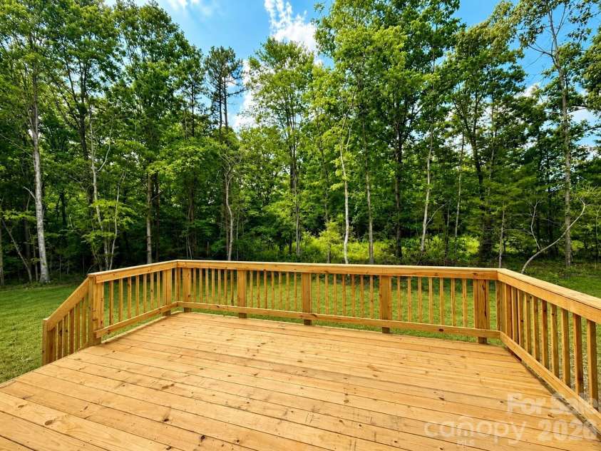 2697 Kendelwood Drive, Lancaster, SC 29720.  MLS# CAR4409067, YatesRealty ID 44346. Oversized deck overlooking back yard and woods