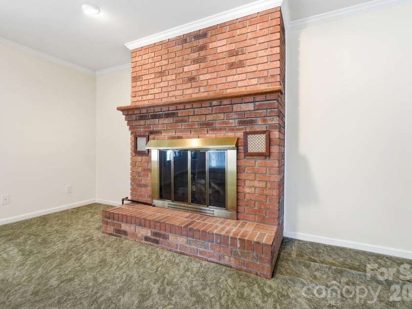 197 Park Road, Mount Holly, NC 28120.  MLS# CAR4414607, YatesRealty ID 44348. Welcoming Fireplace