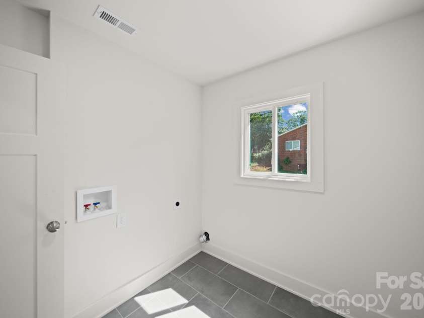 1041 Watts Drive, Charlotte, NC 28216.  MLS# CAR4411321, YatesRealty ID 44365. Laundry Room