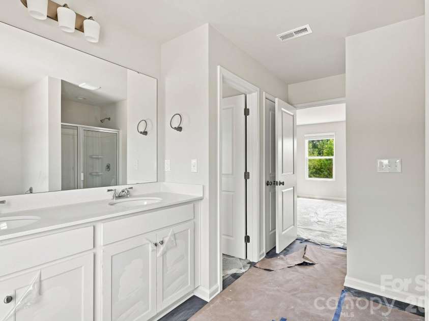 233 Planters Row Road, Iron Station, NC 28080.  MLS# CAR4411723, YatesRealty ID 44370. Primary bath