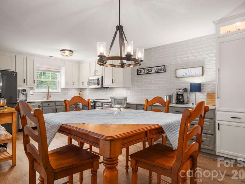 3209 Monte Drive, Monroe, NC 28110.  MLS# CAR4412085, YatesRealty ID 44411. Dining area and open kitchen