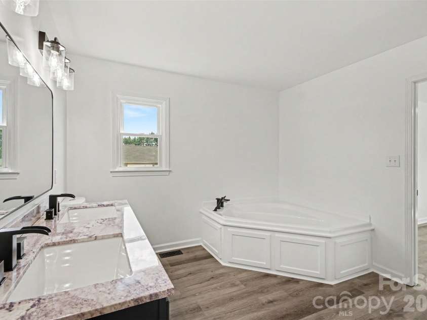 8379 Harvell Road, Stanfield, NC 28163.  MLS# CAR4410609, YatesRealty ID 44417. Ensuite with soaker tub