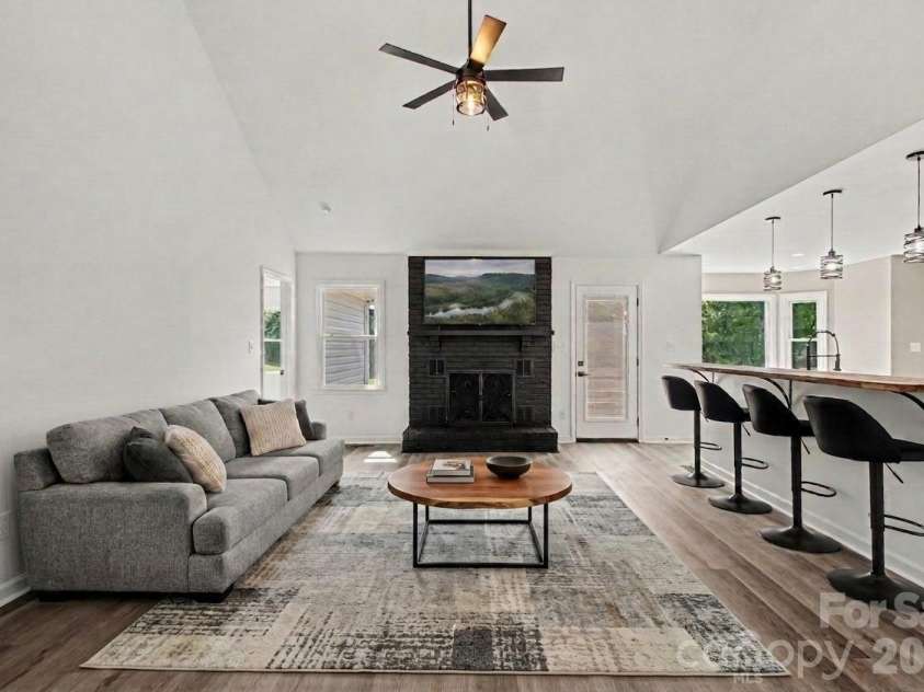 8379 Harvell Road, Stanfield, NC 28163.  MLS# CAR4410609, YatesRealty ID 44417. Virtually staged living room