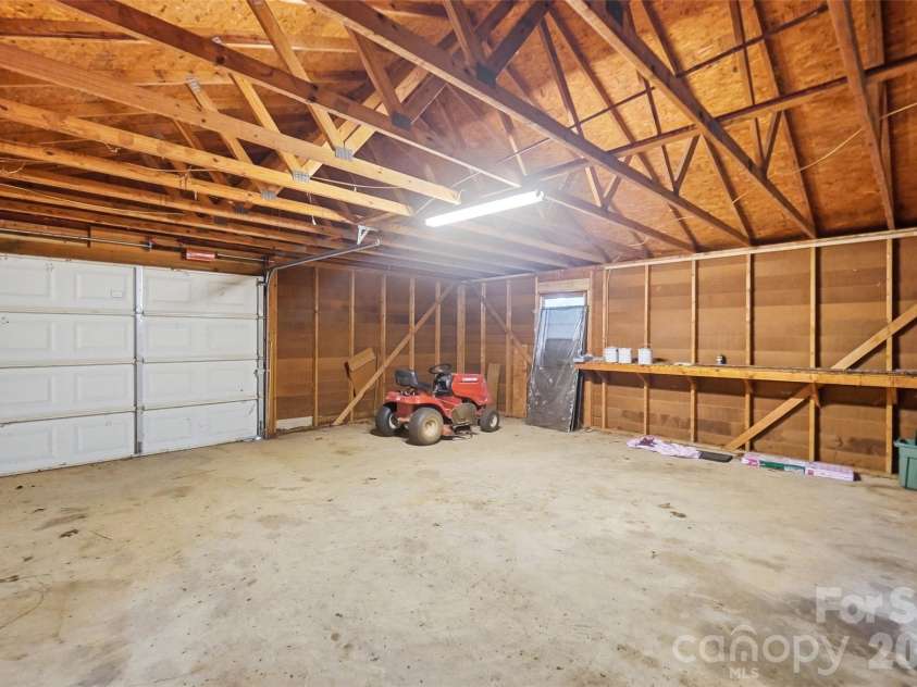 17047 Pond Road, Locust, NC 28097.  MLS# CAR4404743, YatesRealty ID 44419. Detached garage interior