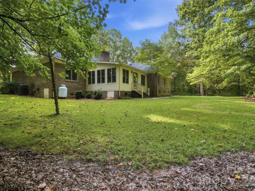 17047 Pond Road, Locust, NC 28097.  MLS# CAR4404743, YatesRealty ID 44419. Rear yard