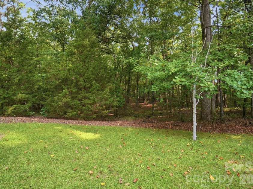 17047 Pond Road, Locust, NC 28097.  MLS# CAR4404743, YatesRealty ID 44419. Rear yard