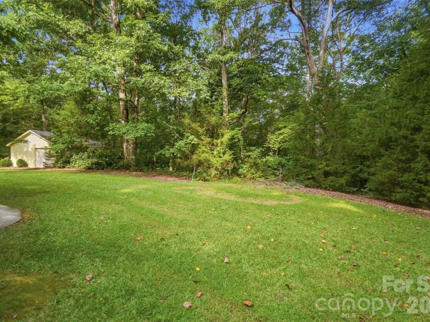17047 Pond Road, Locust, NC 28097.  MLS# CAR4404743, YatesRealty ID 44419. Rear yard