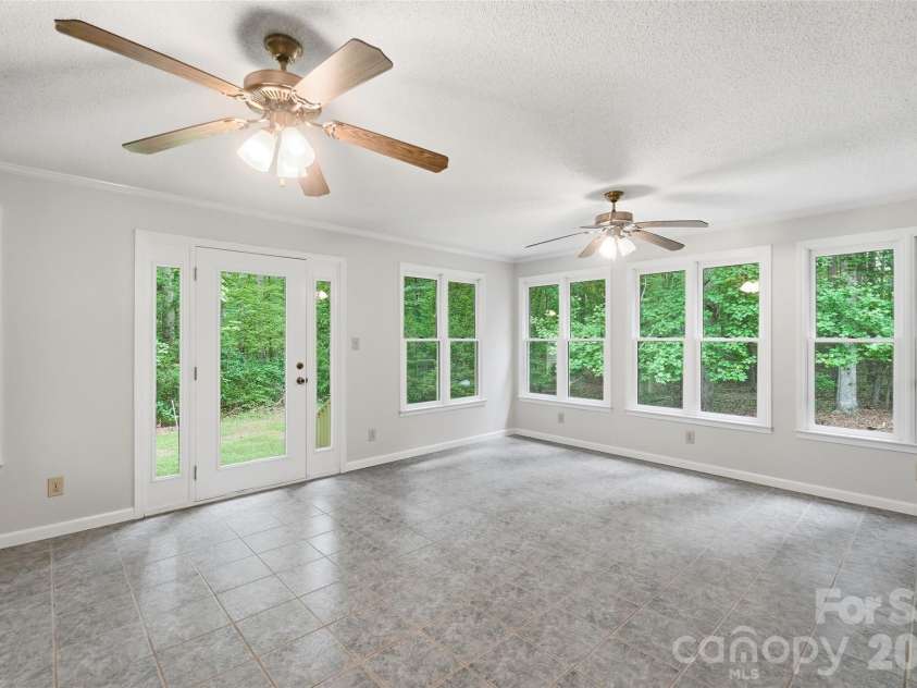 17047 Pond Road, Locust, NC 28097.  MLS# CAR4404743, YatesRealty ID 44419. Sunroom
