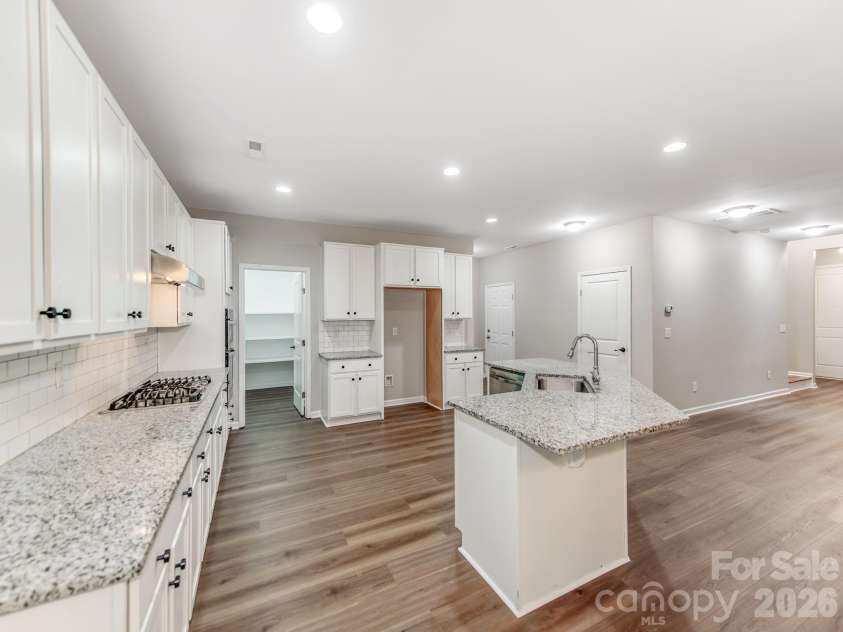 3021 Cresthill Drive, Charlotte, NC 28212.  MLS# CAR4413066, YatesRealty ID 44424. Spacious kitchen with bar top kitchen island