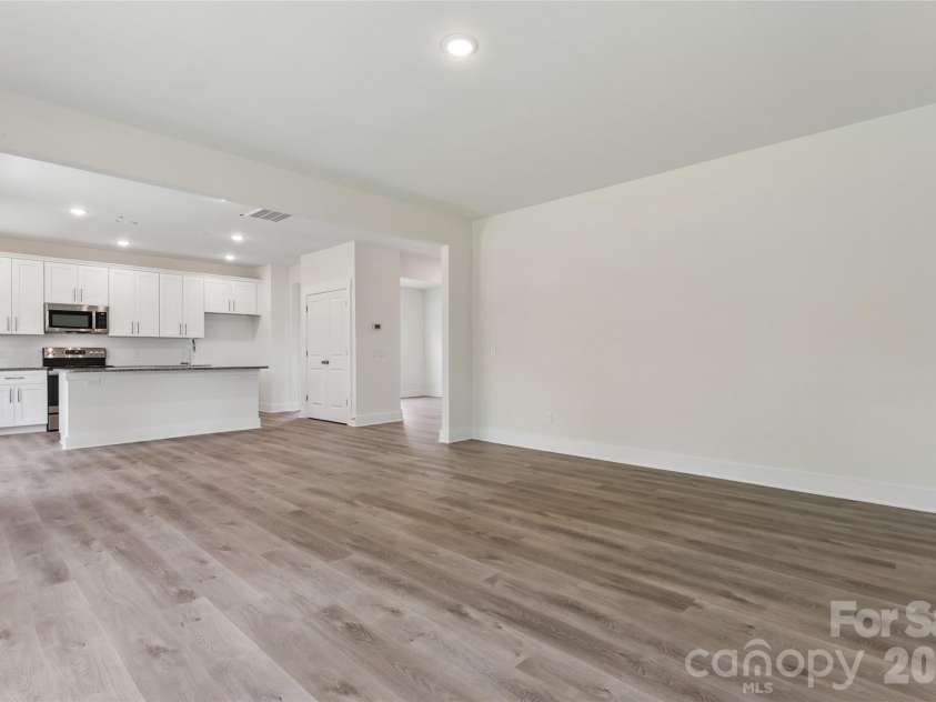 110 Morningside Loop, Troutman, NC 28166.  MLS# CAR4389466, YatesRealty ID 44443. Living Room to Kitchen