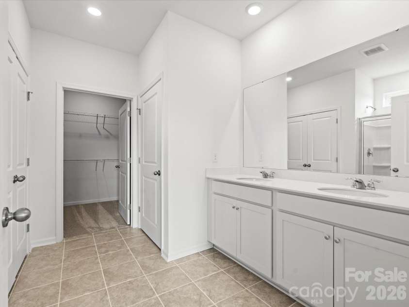 5066 Puddle Pond Road, Indian Trail, NC 28079.  MLS# CAR4414466, YatesRealty ID 44445. Primary bath-Representative photo