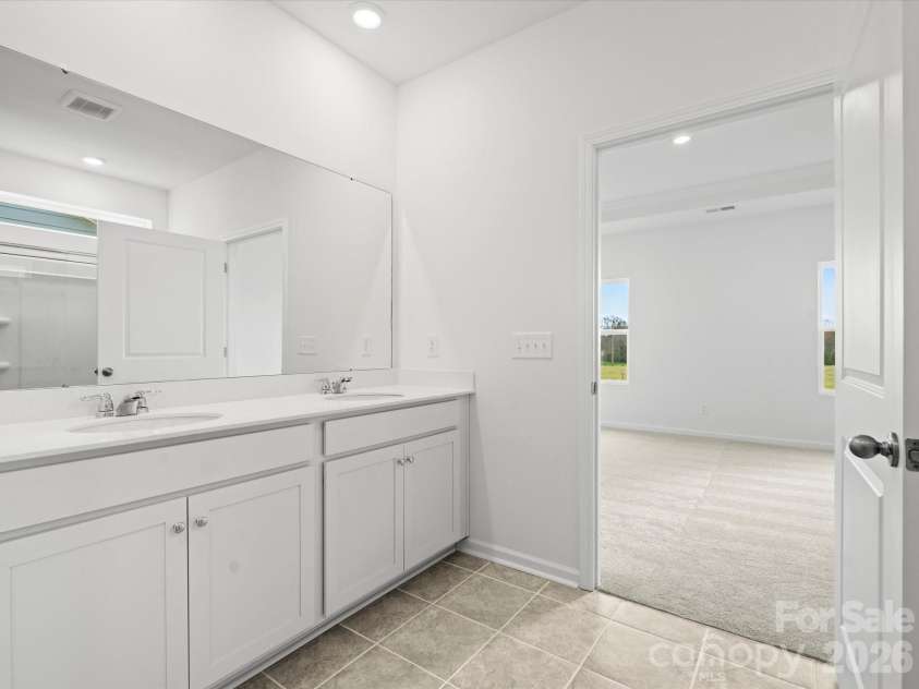 5066 Puddle Pond Road, Indian Trail, NC 28079.  MLS# CAR4414466, YatesRealty ID 44445. Representative photo Primary bath