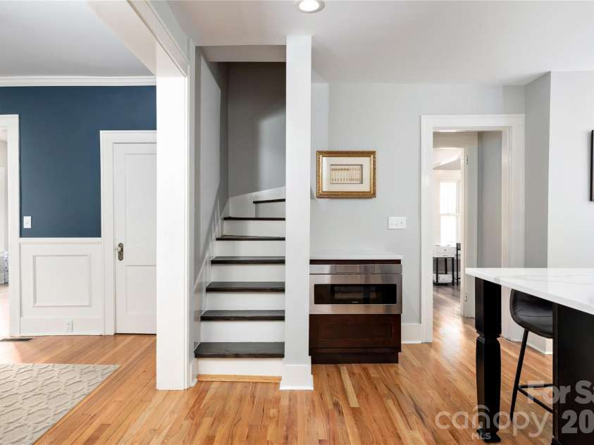 55 Edgemont Road, Asheville, NC 28801.  MLS# CAR4412693, YatesRealty ID 44449. Butler stair case to upper level