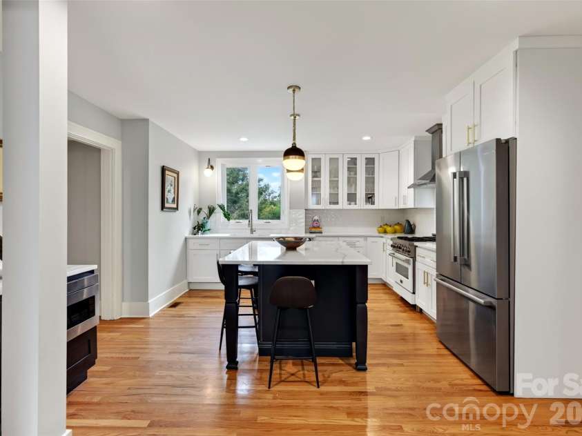 55 Edgemont Road, Asheville, NC 28801.  MLS# CAR4412693, YatesRealty ID 44449. Kitchen from dining area