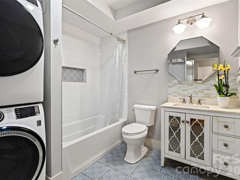 55 Edgemont Road, Asheville, NC 28801.  MLS# CAR4412693, YatesRealty ID 44449. Lower level bathroom with laundry area