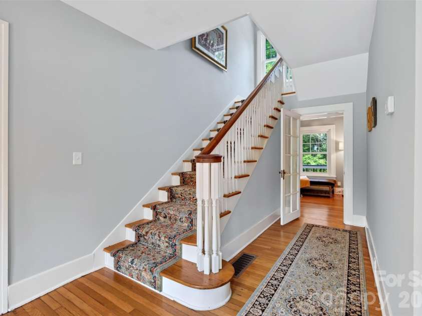 55 Edgemont Road, Asheville, NC 28801.  MLS# CAR4412693, YatesRealty ID 44449. Main stairway to upper level