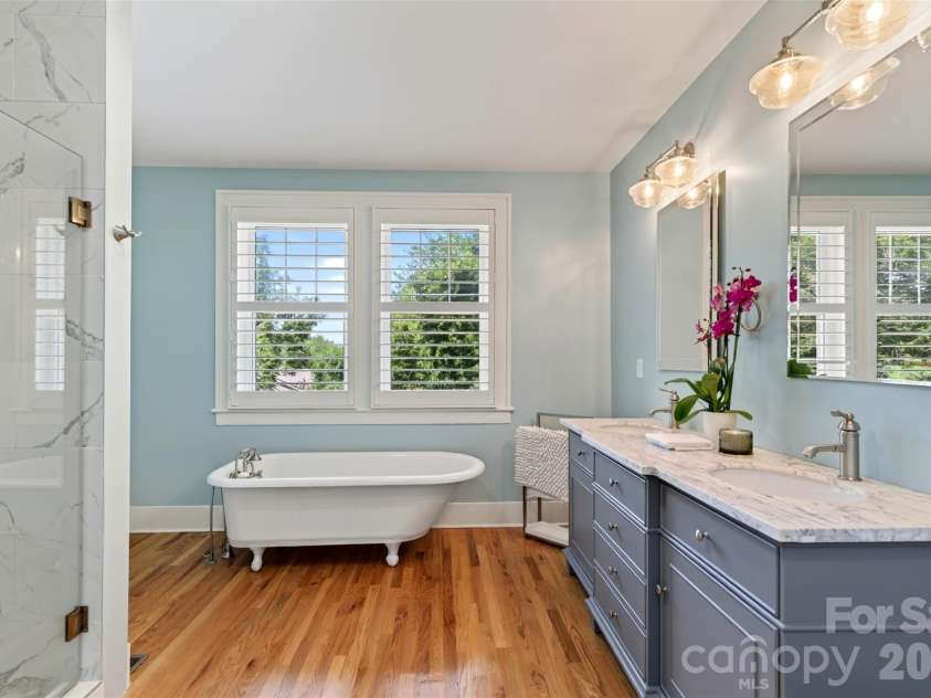 55 Edgemont Road, Asheville, NC 28801.  MLS# CAR4412693, YatesRealty ID 44449. Primary bedroom bath overlooking terraced back yard