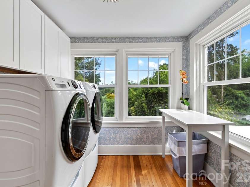 55 Edgemont Road, Asheville, NC 28801.  MLS# CAR4412693, YatesRealty ID 44449. Upper level laundry room overlooking terraced back yard