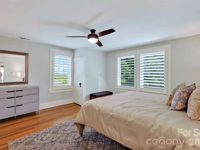 55 Edgemont Road, Asheville, NC 28801.  MLS# CAR4412693, YatesRealty ID 44449. Upper level primary bedroom overlooking back terraced yard