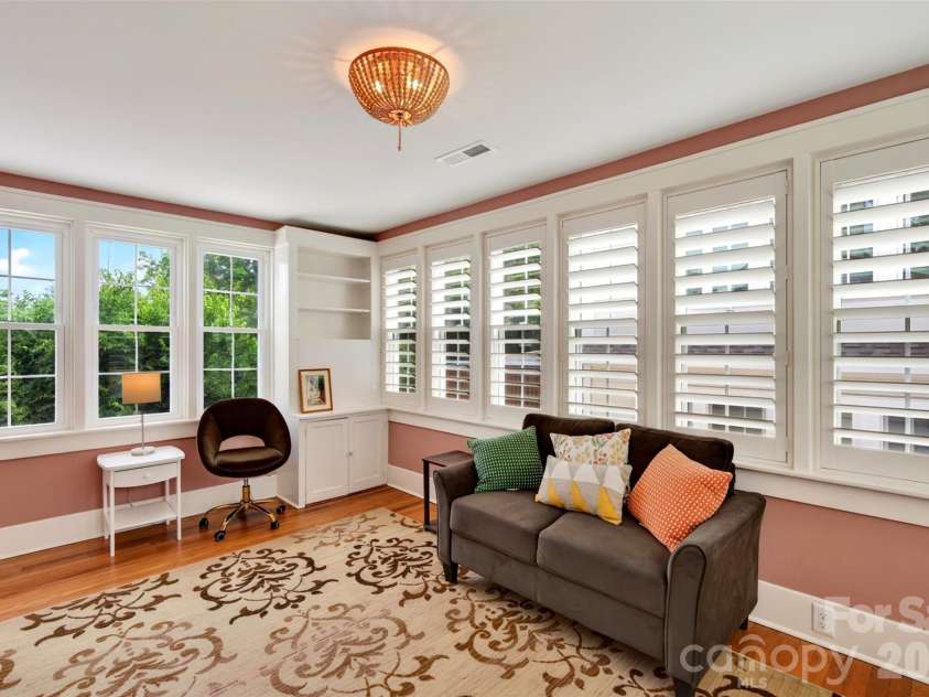 55 Edgemont Road, Asheville, NC 28801.  MLS# CAR4412693, YatesRealty ID 44449. Upper level sun room with built ins