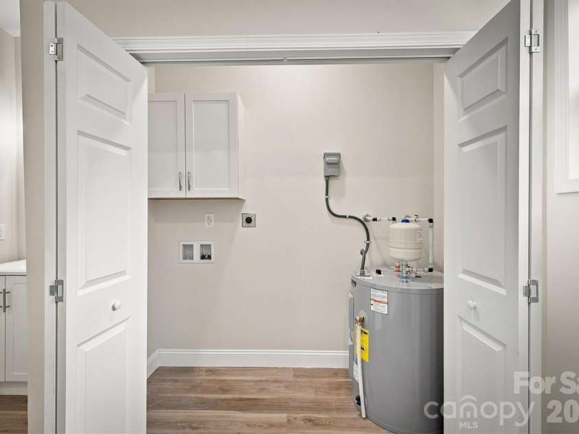 100 Gardner Street, Hickory, NC 28601.  MLS# CAR4414739, YatesRealty ID 44454. Laundry closet in bathroom