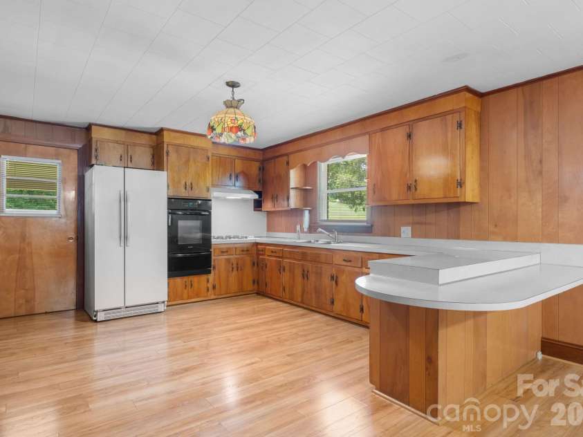 4370 Dynasty Lane, Hudson, NC 28638.  MLS# CAR4413469, YatesRealty ID 44456. Large prep area for cooking with built in breakfast area