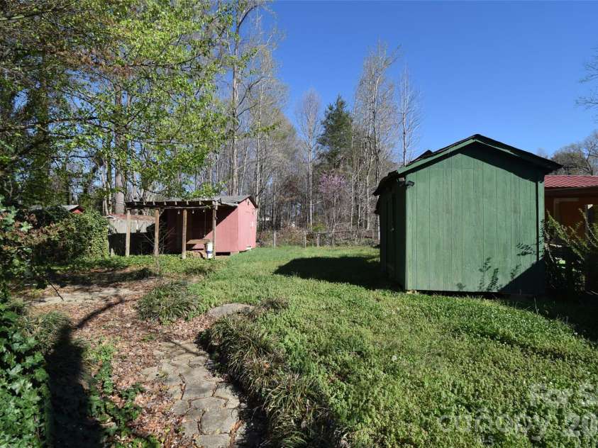 2546 Amber Crest Drive, Gastonia, NC 28052.  MLS# CAR4358400, YatesRealty ID 4446. Back yard with 2 storage buildings