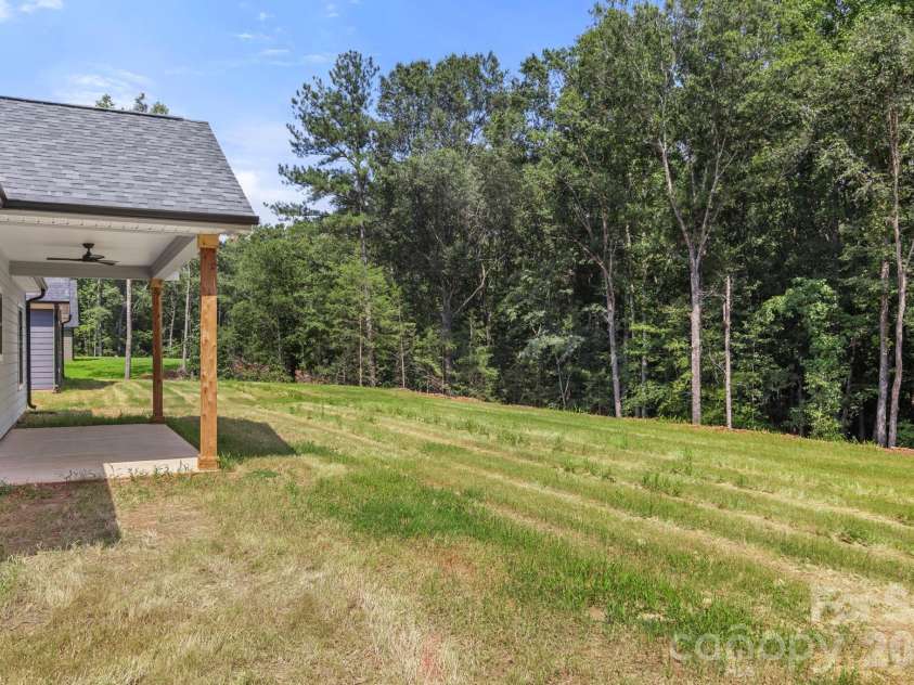 151 McCorkle Street, York, SC 29745.  MLS# CAR4414413, YatesRealty ID 44460. Backyard - Wooded