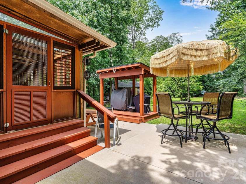 7697 Katherine Drive, Denver, NC 28037.  MLS# CAR4414395, YatesRealty ID 44462. Backyard patio