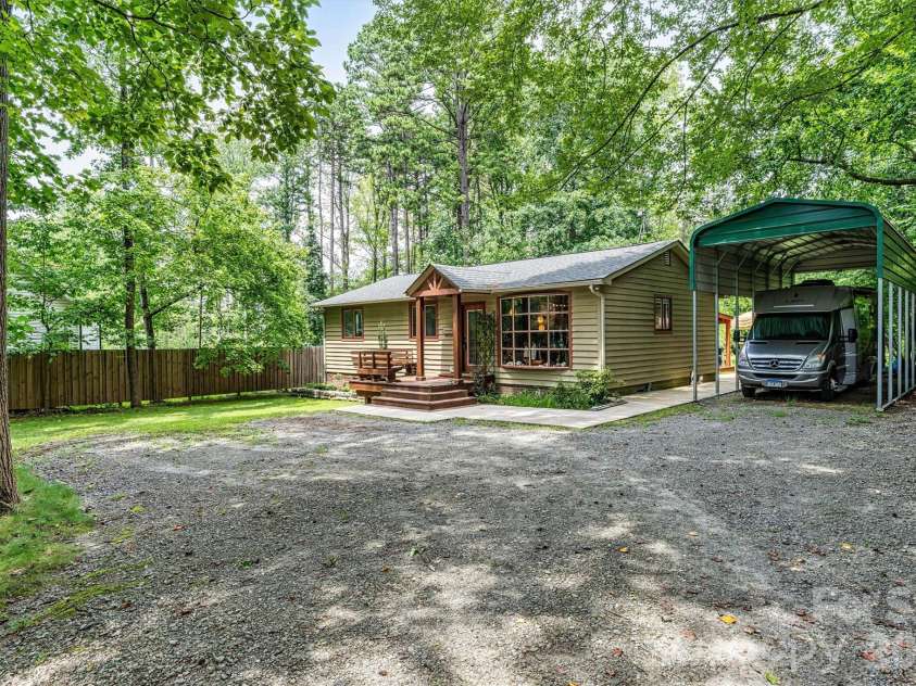 7697 Katherine Drive, Denver, NC 28037.  MLS# CAR4414395, YatesRealty ID 44462. Side front yard