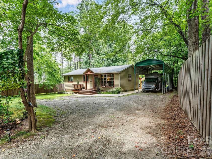 7697 Katherine Drive, Denver, NC 28037.  MLS# CAR4414395, YatesRealty ID 44462. Side front yard