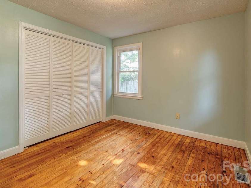 4 La Rue Street, Asheville, NC 28806.  MLS# CAR4414587, YatesRealty ID 44467. Front facing bedroom with ample sized closet