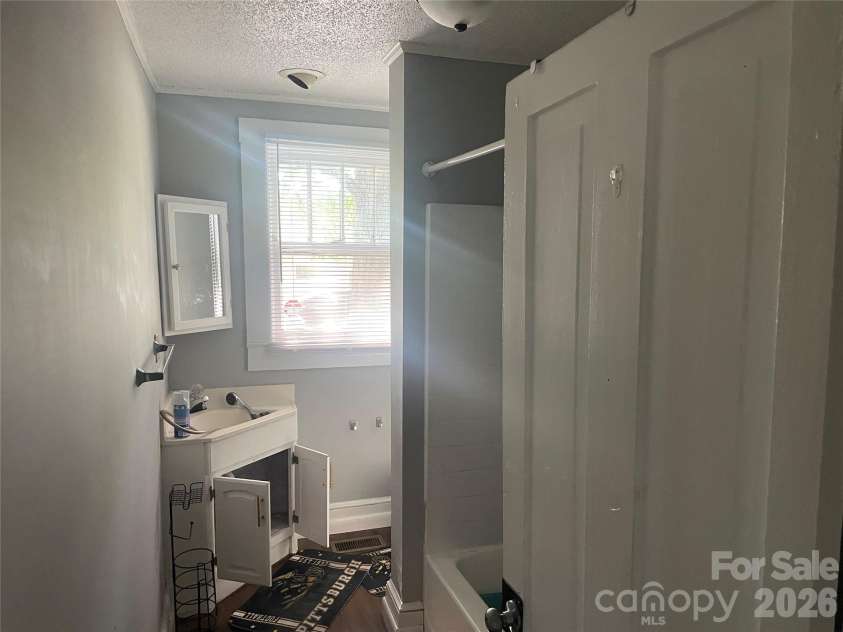 1235 Freeman Avenue, Albemarle, NC 28001.  MLS# CAR4414915, YatesRealty ID 44477. Vacant Side - Bathroom