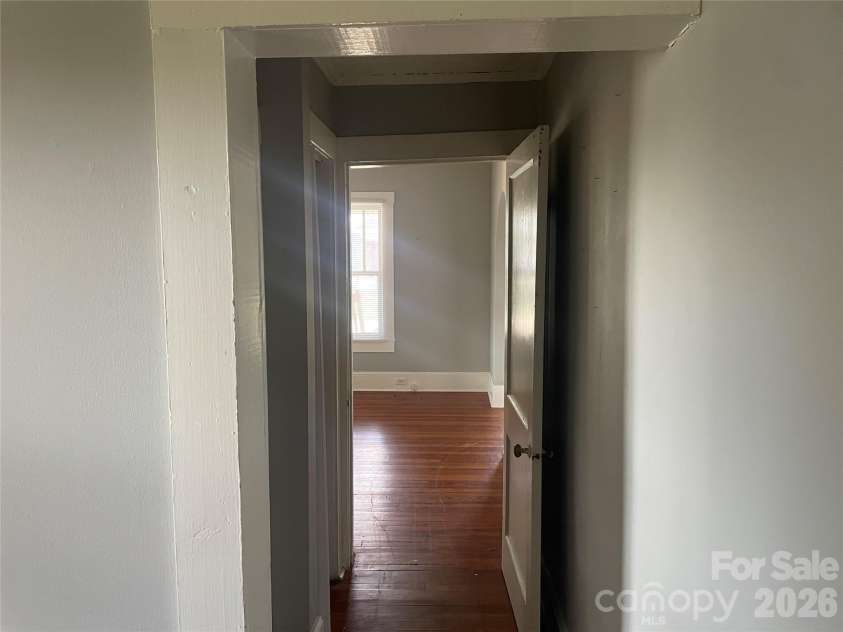 1235 Freeman Avenue, Albemarle, NC 28001.  MLS# CAR4414915, YatesRealty ID 44477. Vacant Side Hallway