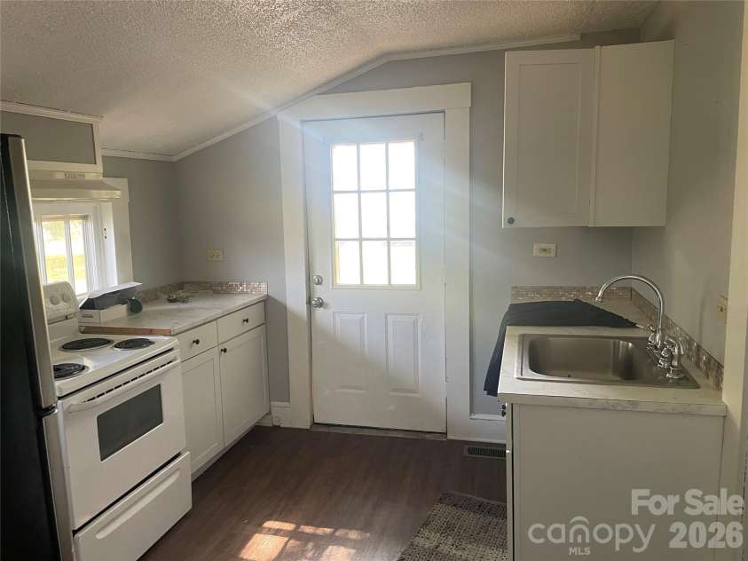 1235 Freeman Avenue, Albemarle, NC 28001.  MLS# CAR4414915, YatesRealty ID 44477. Vacant Side - Kitchen