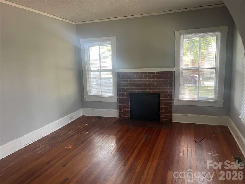 1235 Freeman Avenue, Albemarle, NC 28001.  MLS# CAR4414915, YatesRealty ID 44477. Vacant Side - Living Room