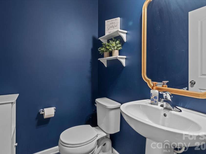 7513 Meridale Forest Drive, Charlotte, NC 28269.  MLS# CAR4414384, YatesRealty ID 44504. Downstairs Half Bathroom