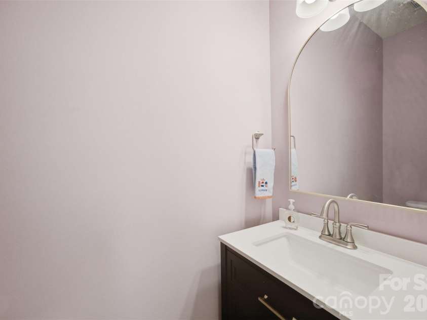 7315 Mill Ruins Avenue, Concord, NC 28025.  MLS# CAR4414365, YatesRealty ID 44508. Downstairs half bath