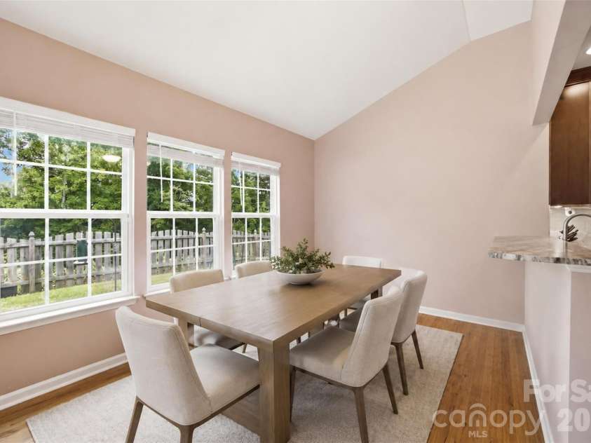 7315 Mill Ruins Avenue, Concord, NC 28025.  MLS# CAR4414365, YatesRealty ID 44508. Virtually staged with a table