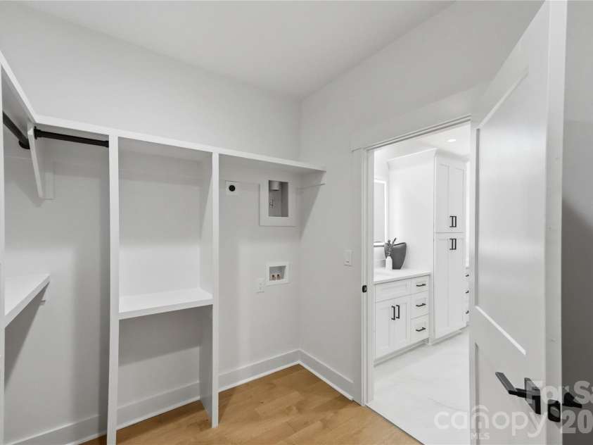 21017 Entrada Drive, Cornelius, NC 28031.  MLS# CAR4401505, YatesRealty ID 44524. Primary Closet w/laundry space