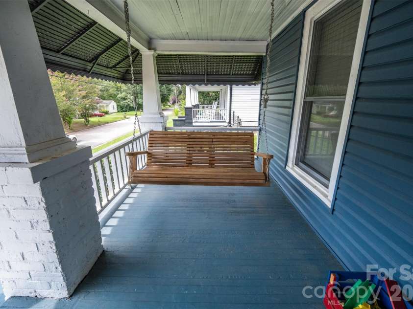 702 5th Street, Spencer, NC 28159.  MLS# CAR4413894, YatesRealty ID 44529. Front porch swing